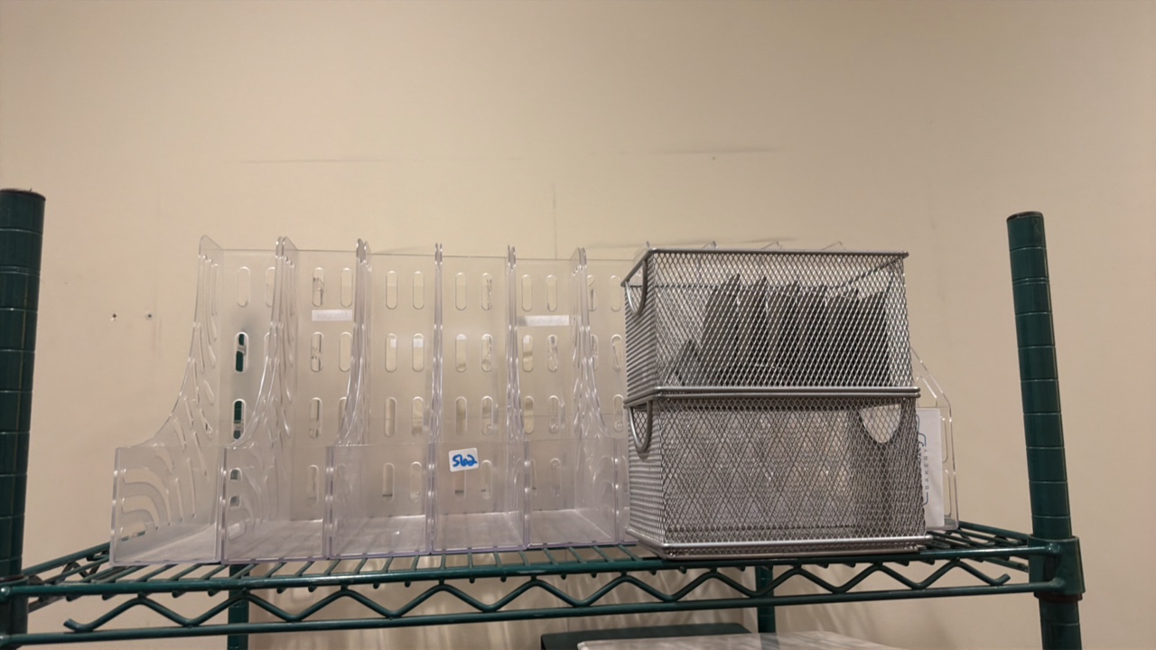 lot 562 image: shelf of office supplies