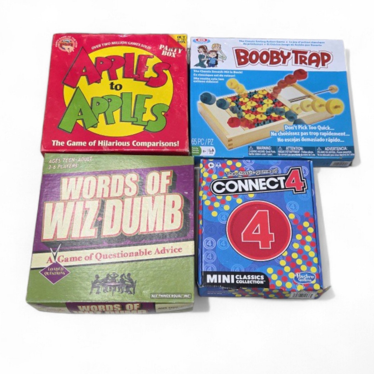 Board Game Lot - Apples to Apples, Booby Trap, Words of Wiz-Dumb and Mini Connect 4