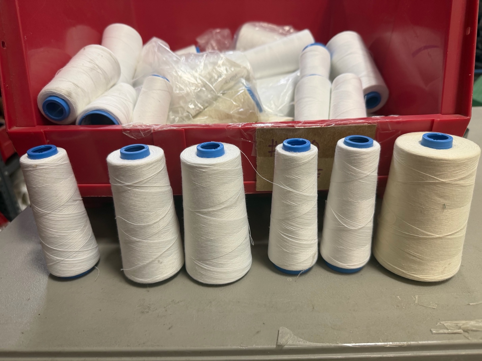Bucket of serger white threads