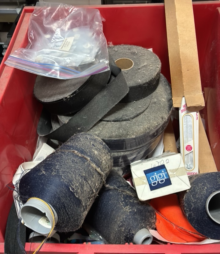 miscellaneous bin of Velcro embroidery thread zippers patches