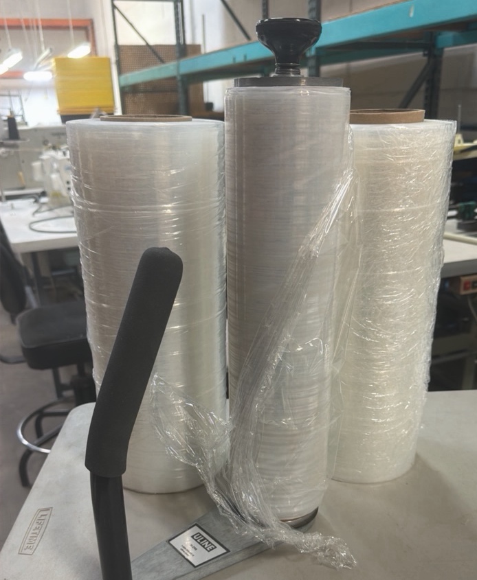 2 12 rolls of shrink wrap and manual shrink wrap device