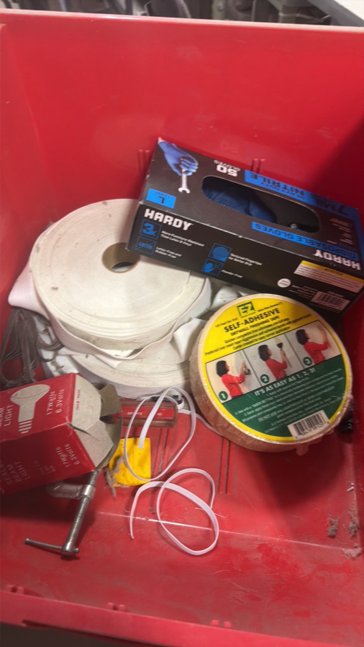 tote of miscellaneous, self adhesive elastic gloves