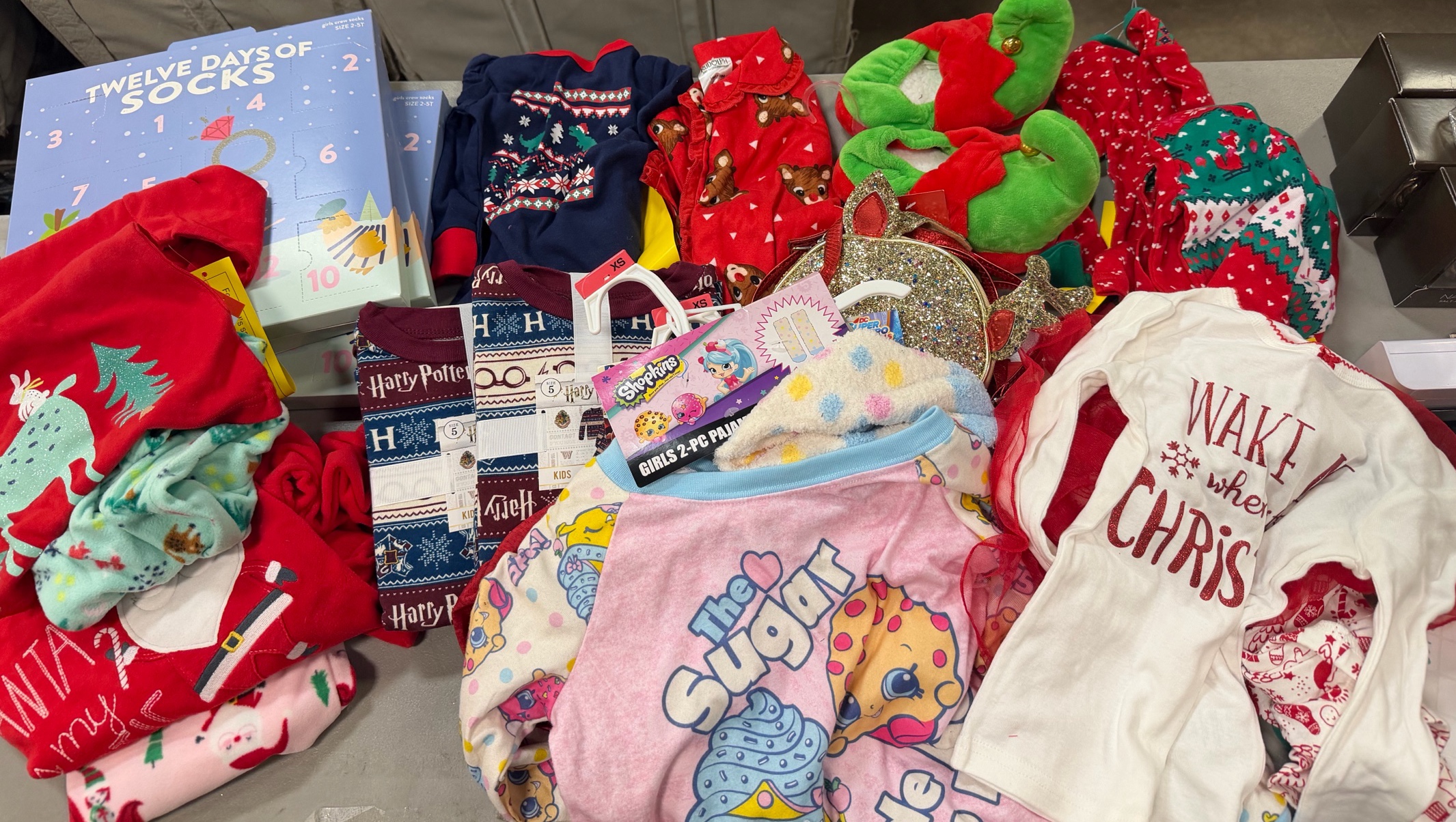 Bin of holiday, sleepwear, socks, and accessories