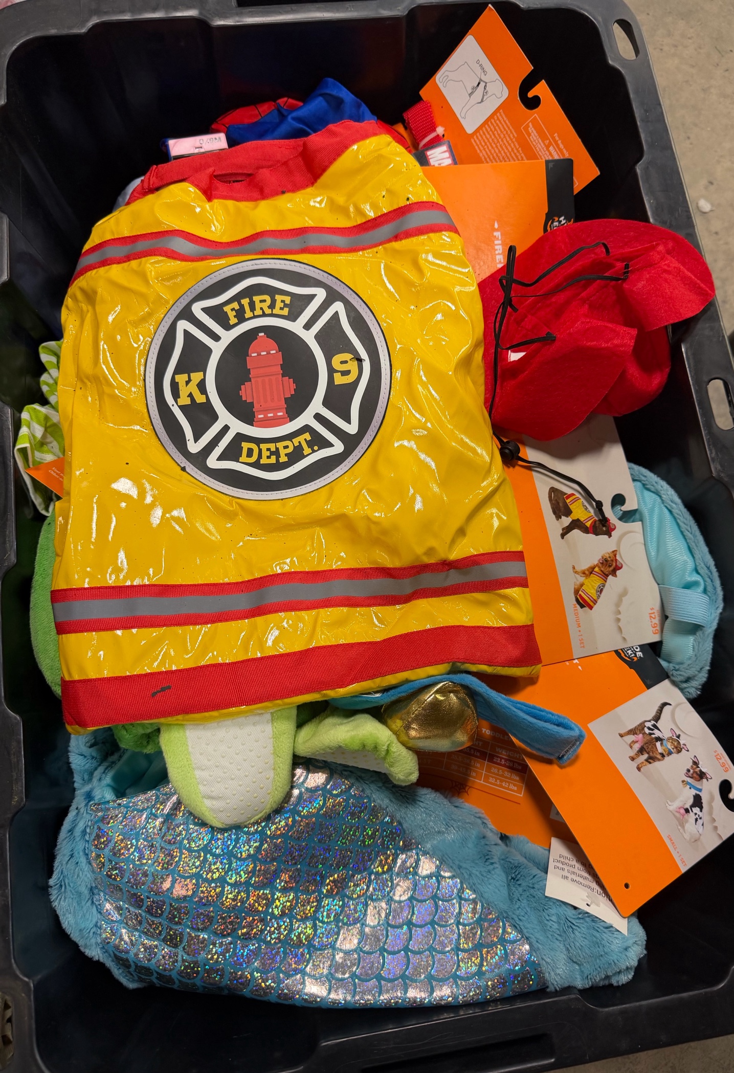 bin of Halloween costumes