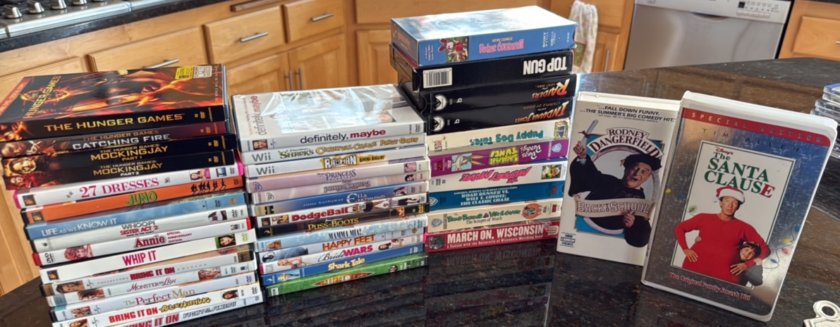 Assortment of kids, chick flick movies and VHS tapes