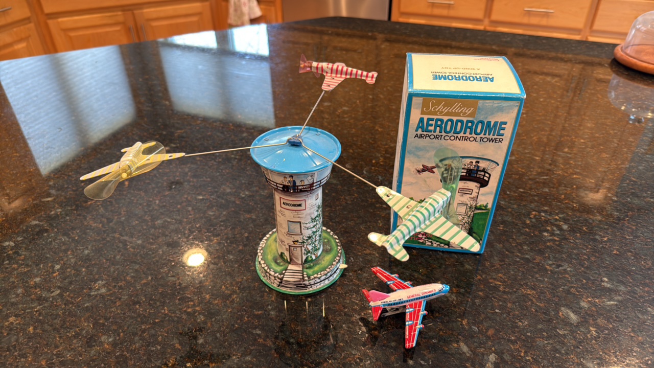 Schylling Aerodrome airport control and American Airlines General Dynamics small metal plane