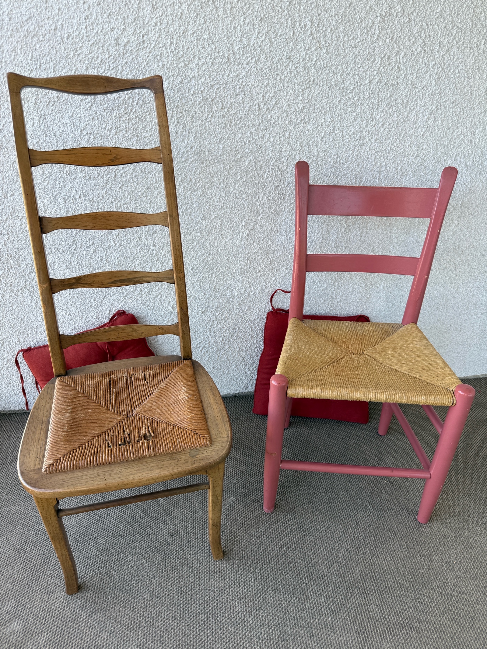 Two vintage Brutalist style ladder chairs with woven wicker seats.