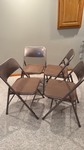 four Samsonite folding chairs