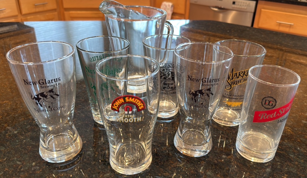 Collection of Fun Beer glasses and a pitcher