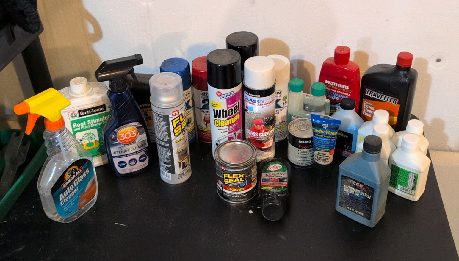 hodgepodge of oil and other random liquids in a green bucket