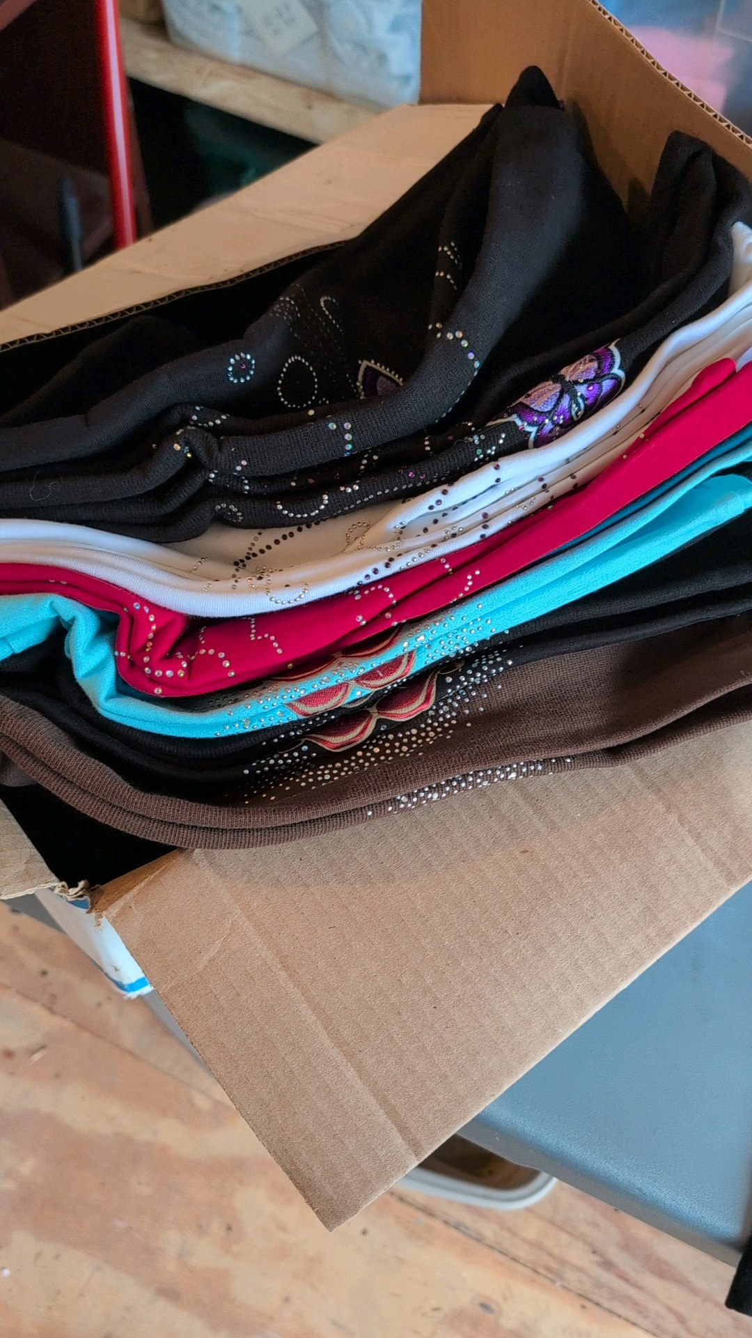 Lot of bedazzled ladies tank tops of multiple colors