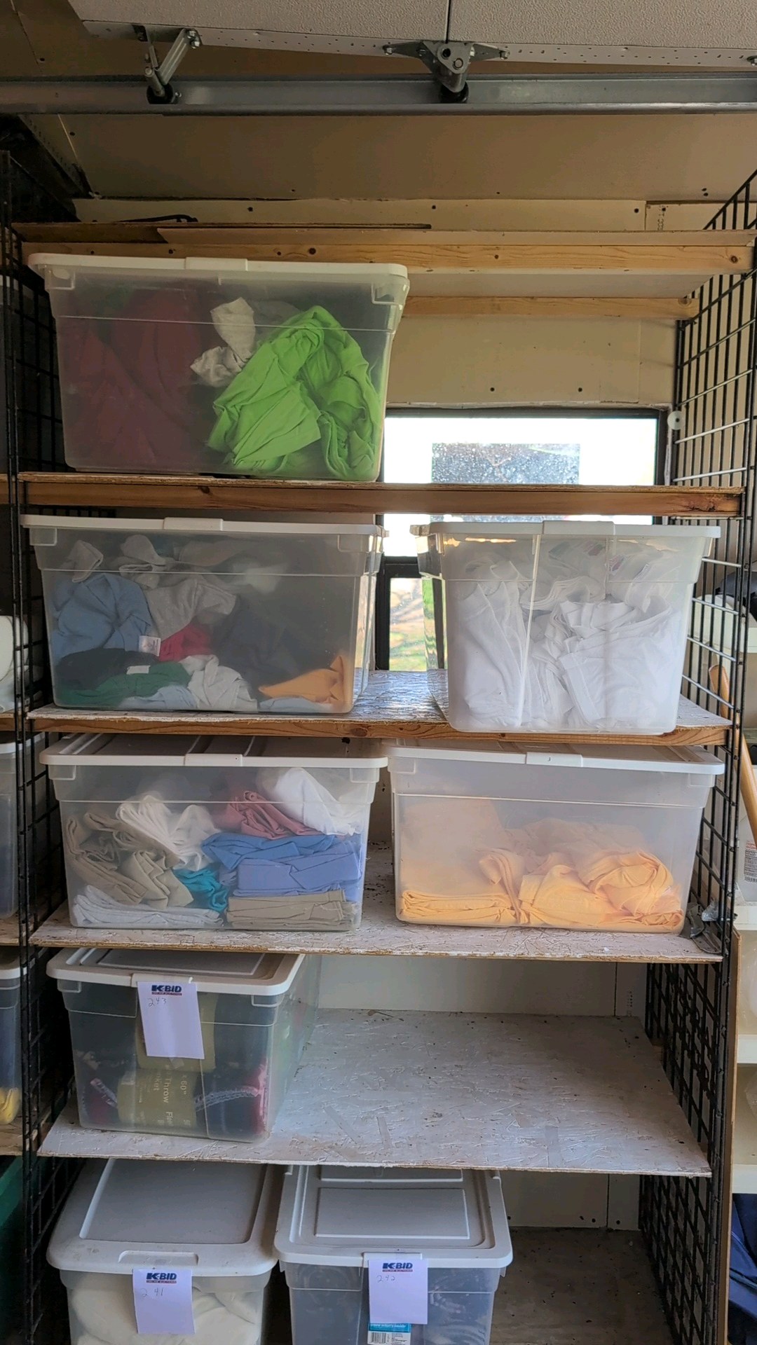 five bins of shirts and more