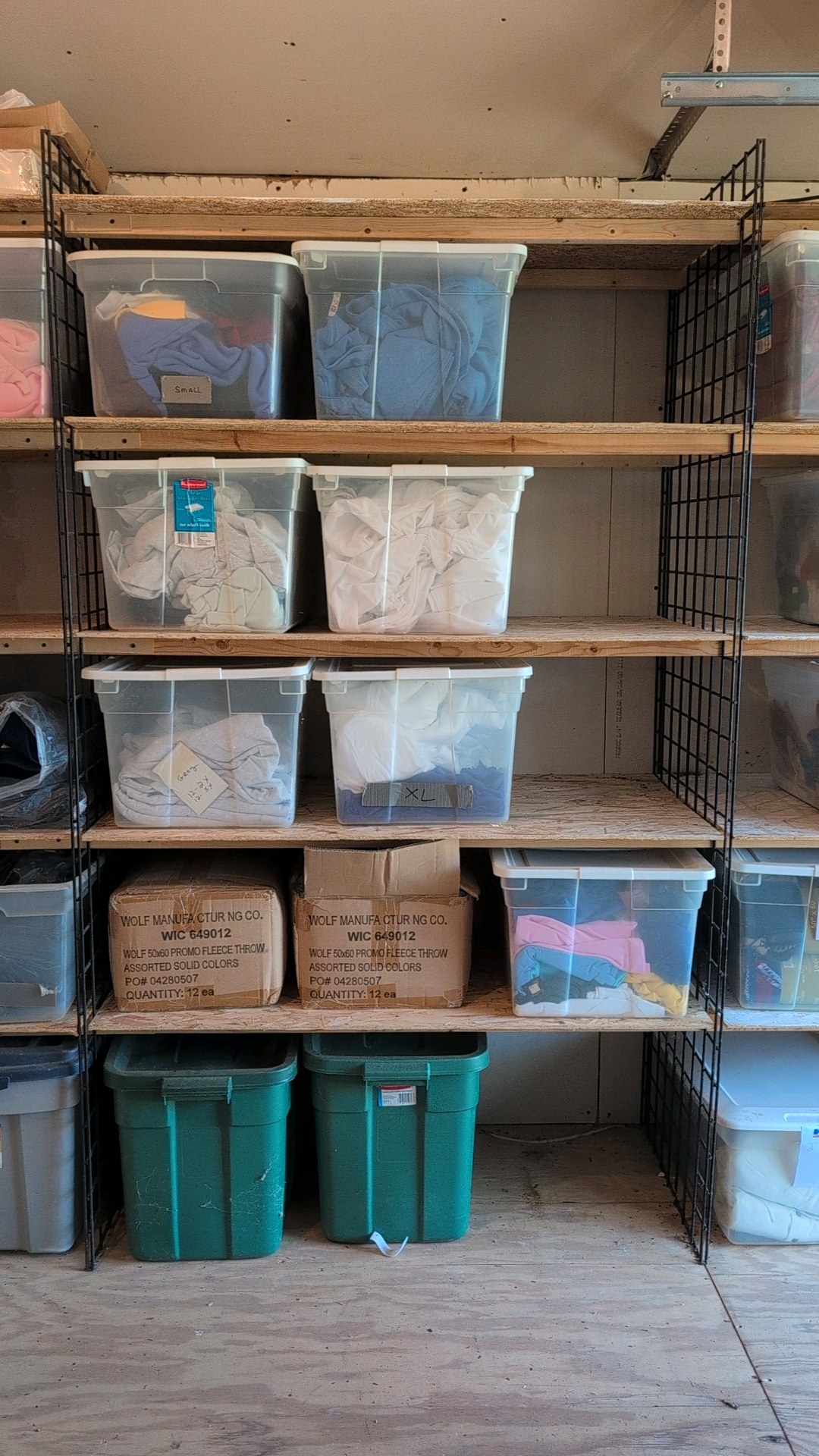 11 boxes of shirts, blankets, sweatshirts miscellaneous overstock