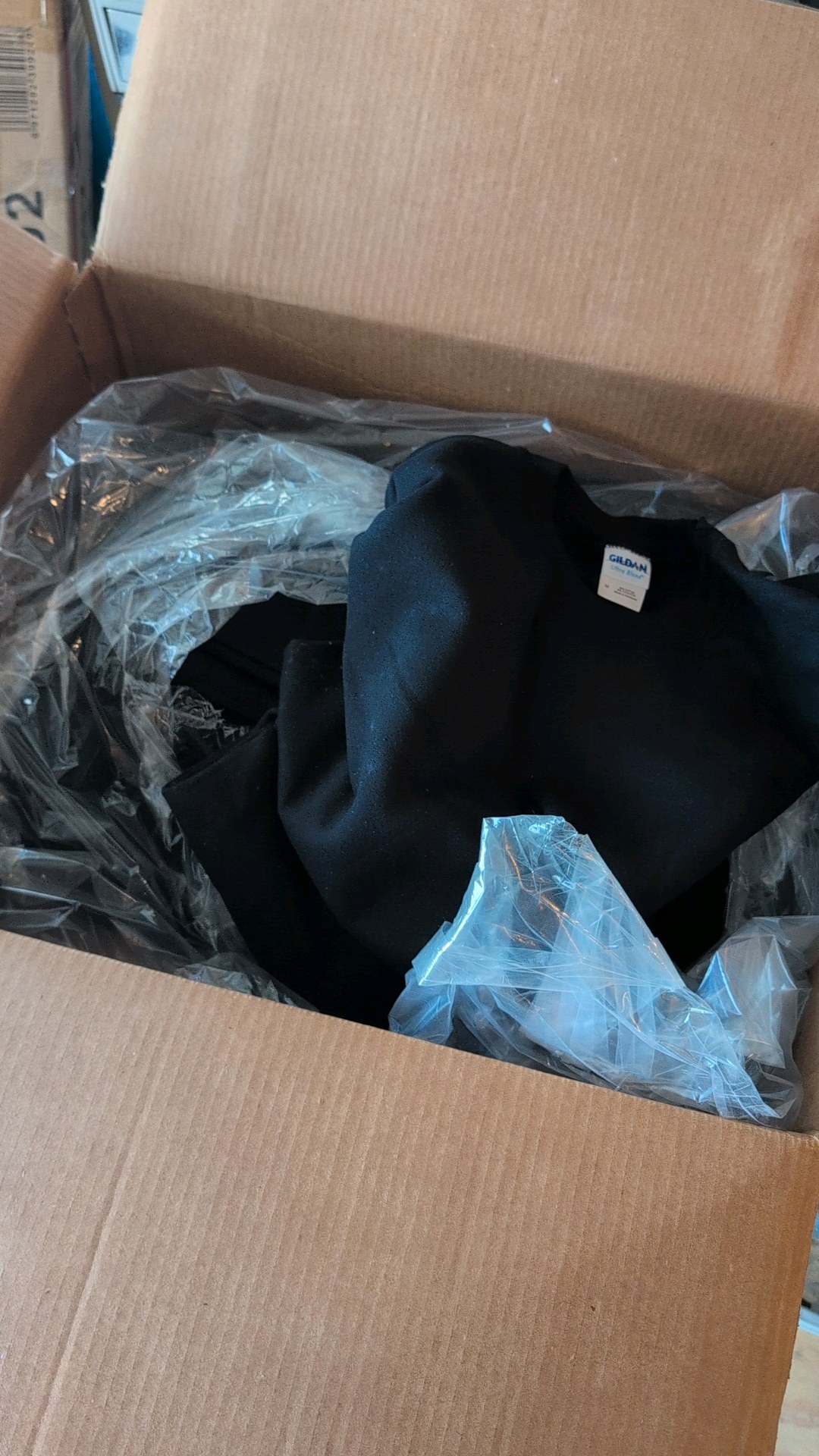 two boxes of sweatshirts