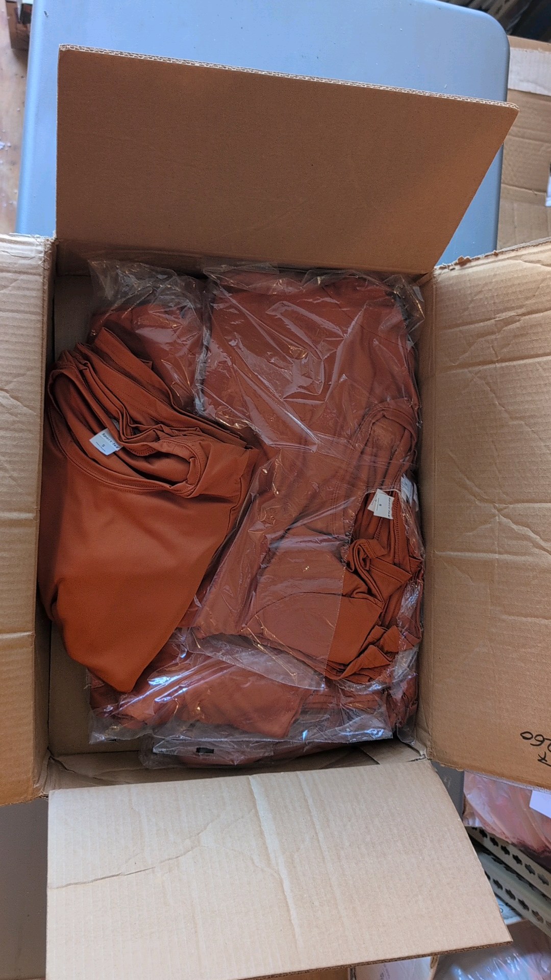 box of Sport-Tec tees