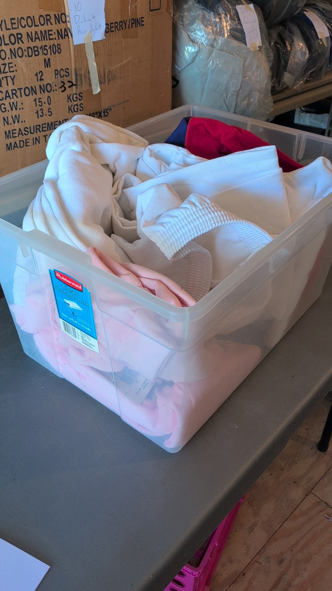 box of sweat pants and sweatshirts