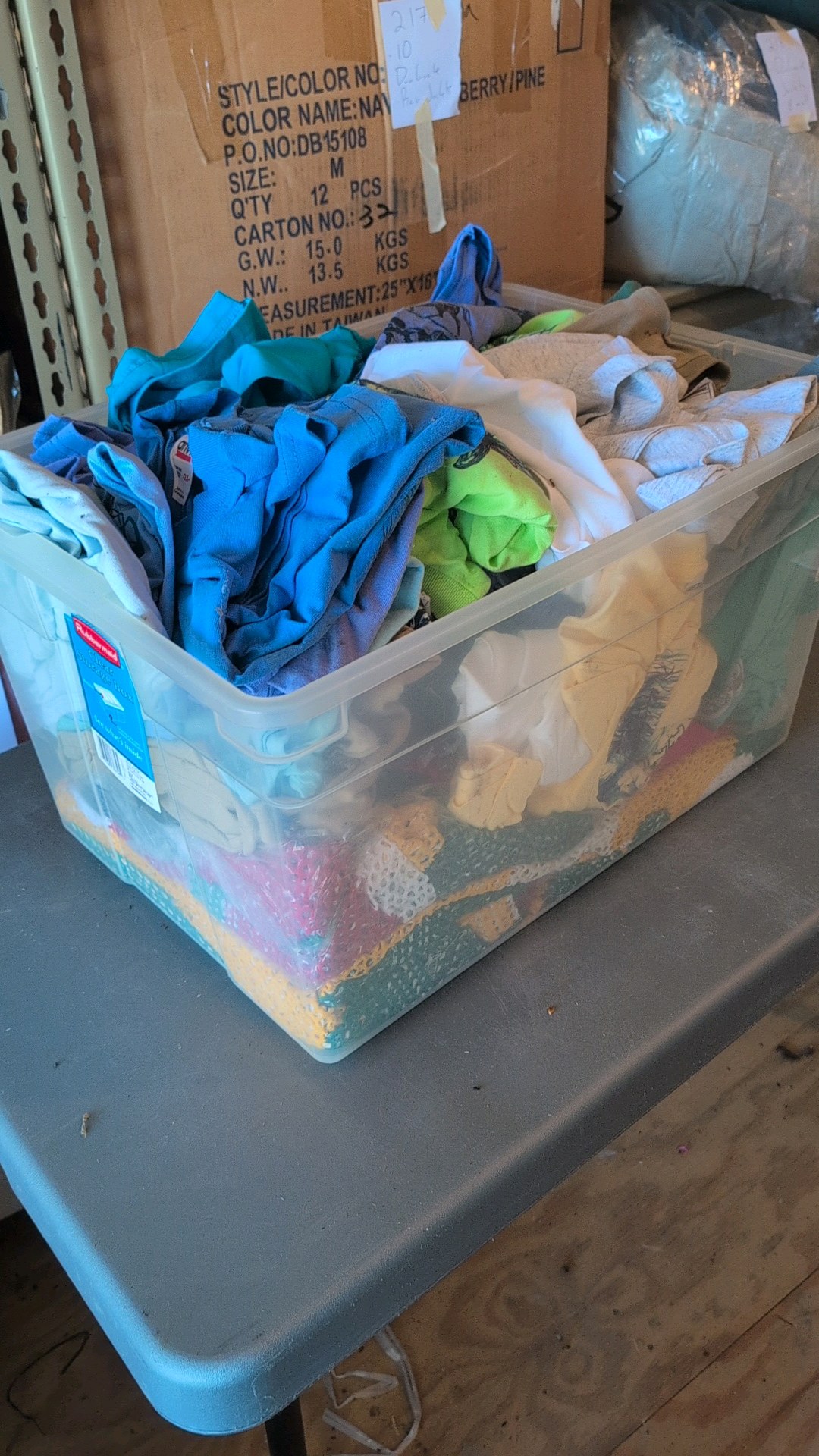 box of shirts and blankets or some sort of retail