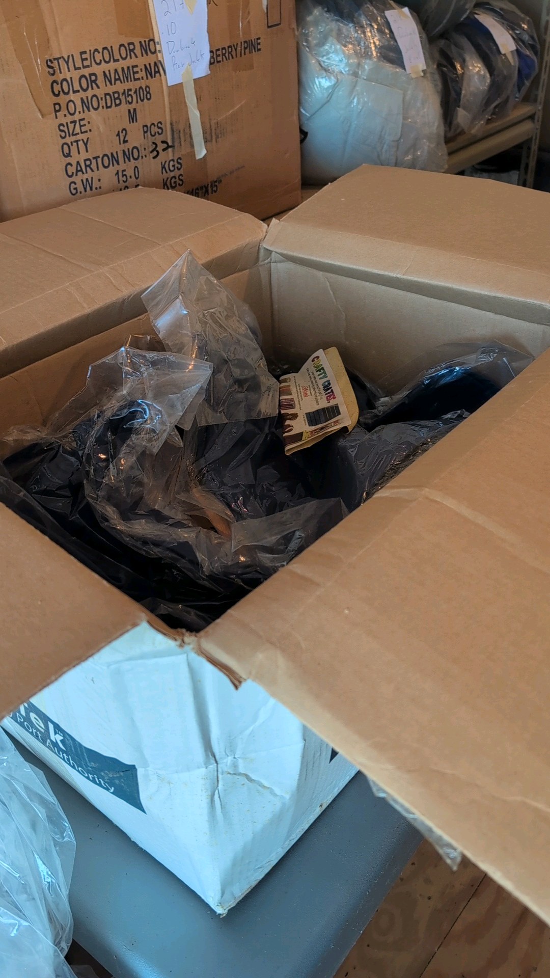 box of Port authority colored button-up