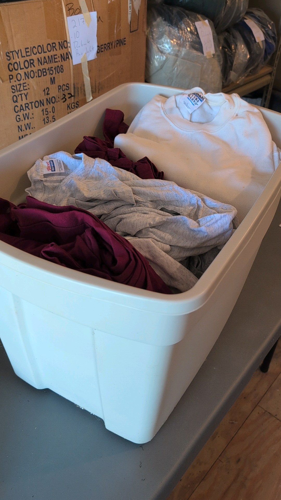 box of t-shirts and sweatshirts