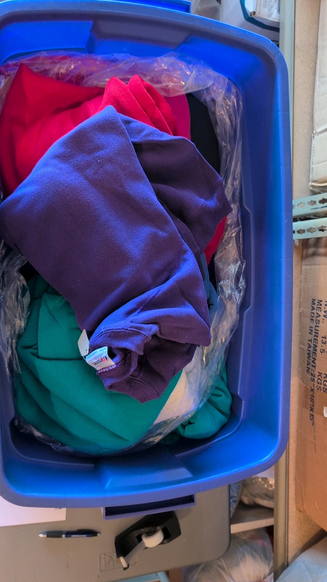bin of sweatshirts