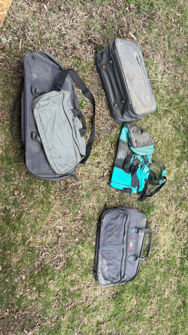A lot of vintage duffel bags and suitcases