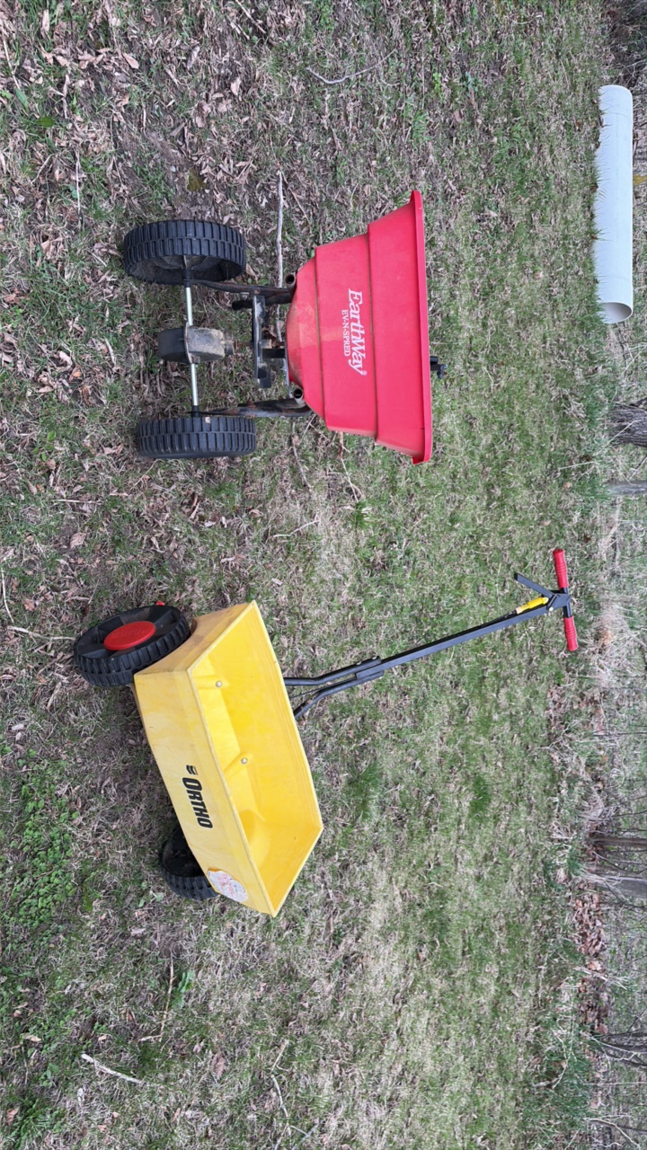 two spreaders one manual one with hitch
