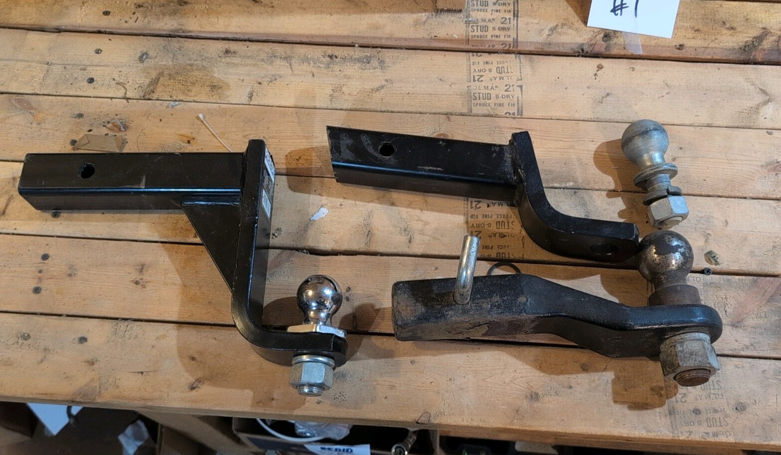 Lot of trailer hitches and balls