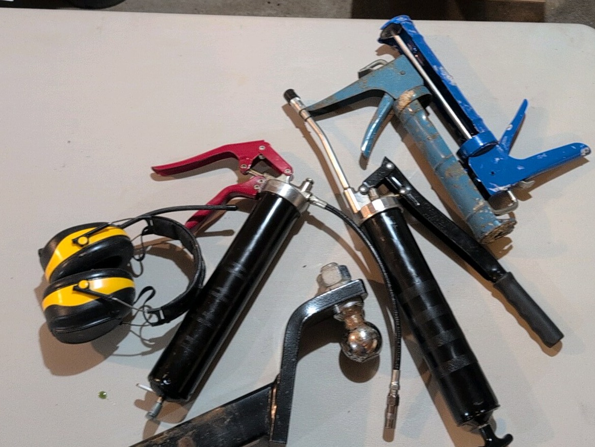 Grease gun ear protection, caulk gun and trailer hitch