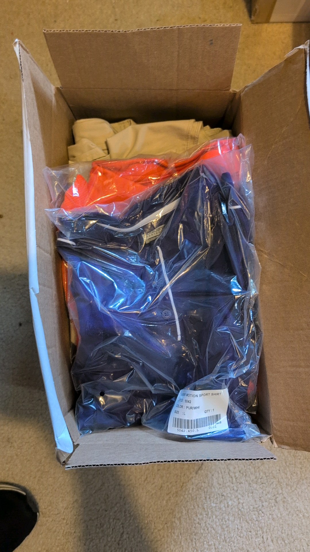 unopened box of estate hats and shirts