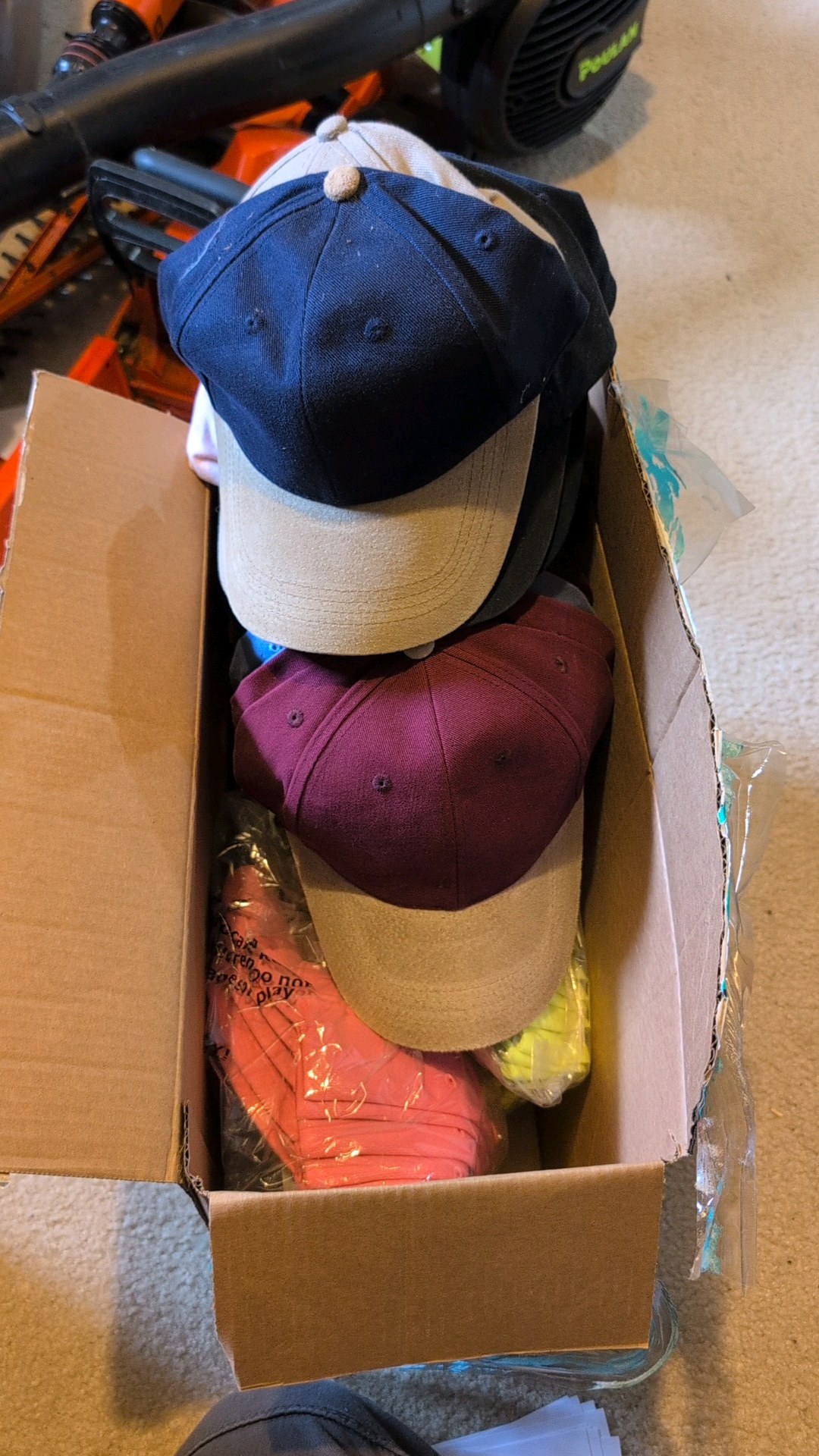 box of hats that are still tagged