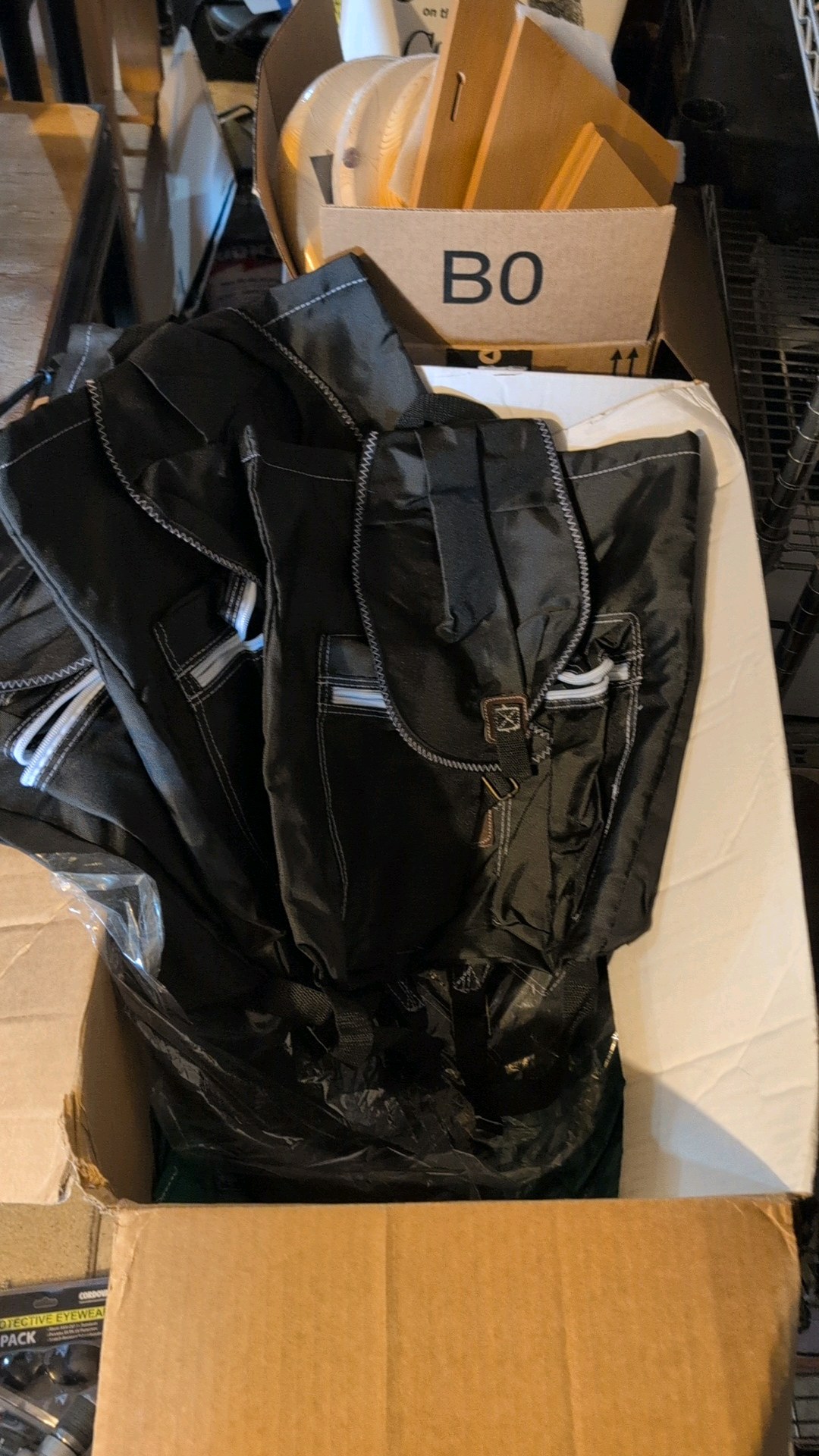 Large box of new backpack bags