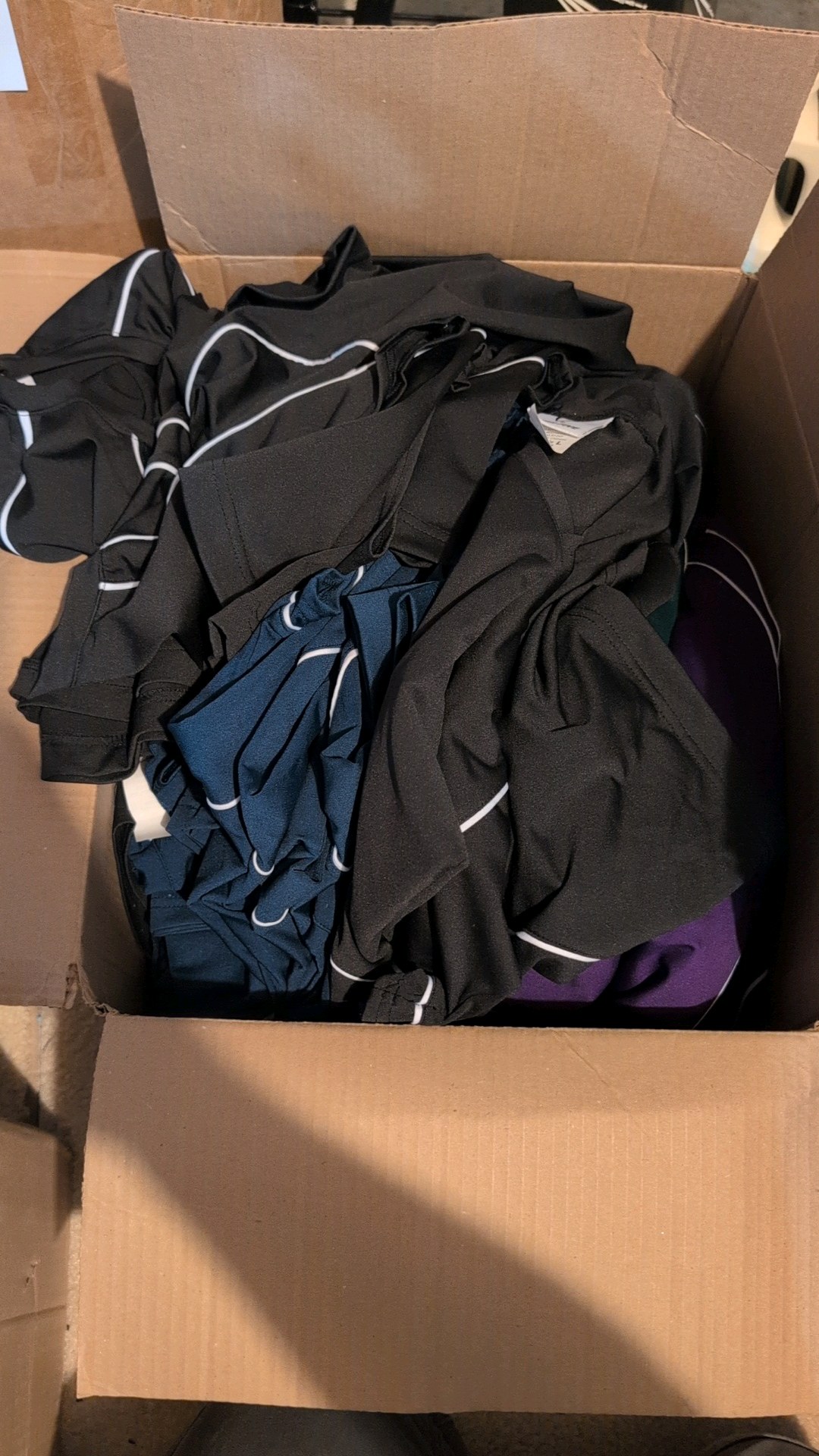 Large box of new womens clothing. short sleeve tanks