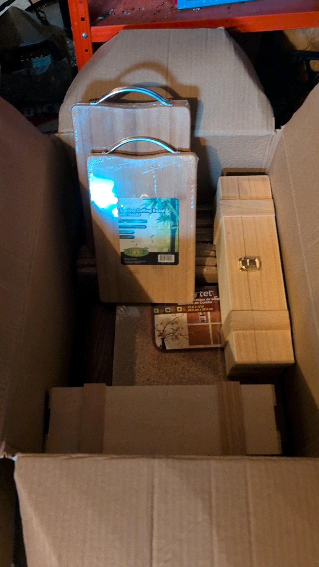 Large box of items bamboo cutting board, cork board boxes and more