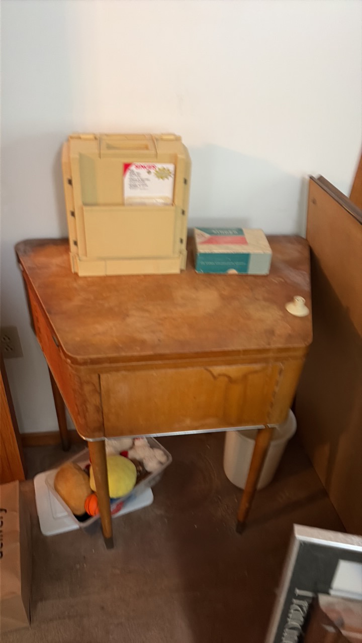 vintage sewing machine with singer thread holder and sewing machine attachments