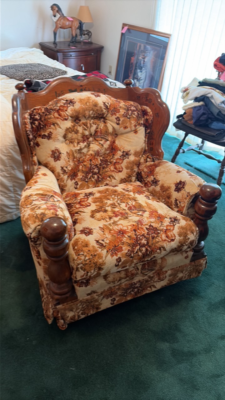 two wooden chairs with design
