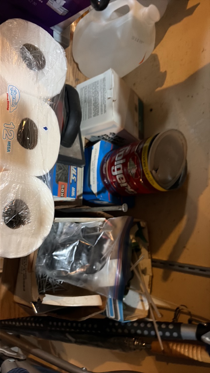 shelf contents including fertilizer, cleaner, nail screws, and tools