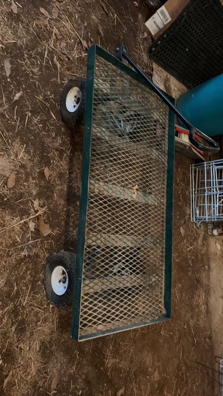three wheelbarrows and one rolling cart