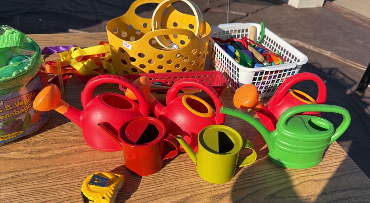 lot of musical, fruit and watering cans