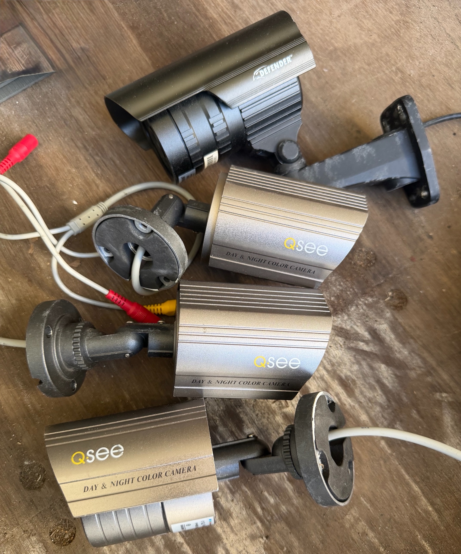 four cameras and bag of wire