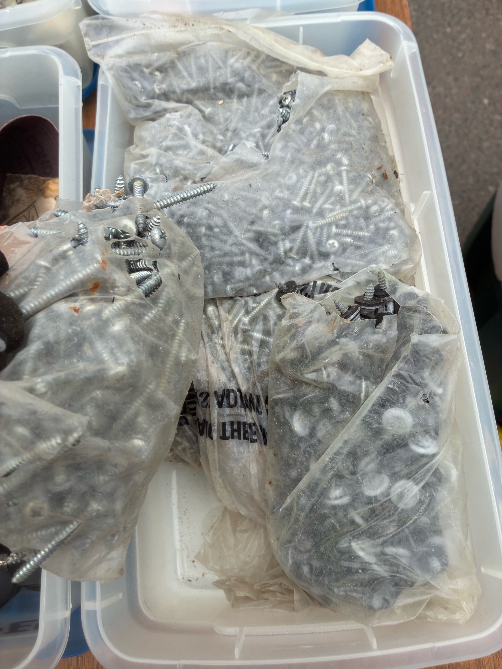 tote of screws, bolts, and miscellaneous