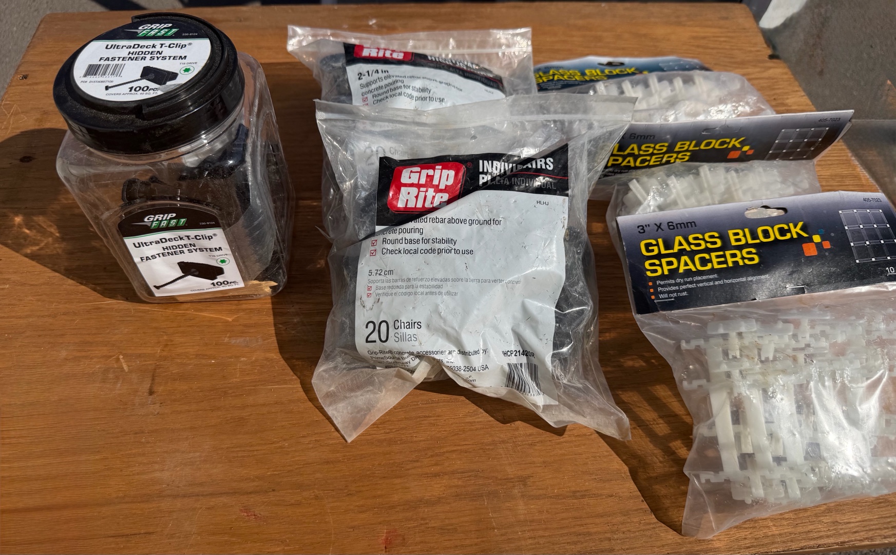 Glass block spacers, plastic high chairs, deck, and clip systems