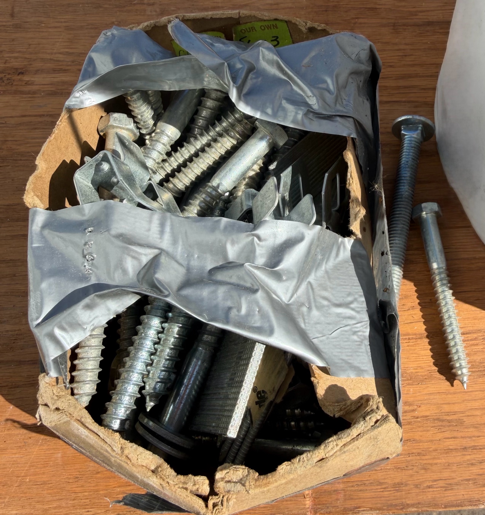 assorted bucket of staples and screws