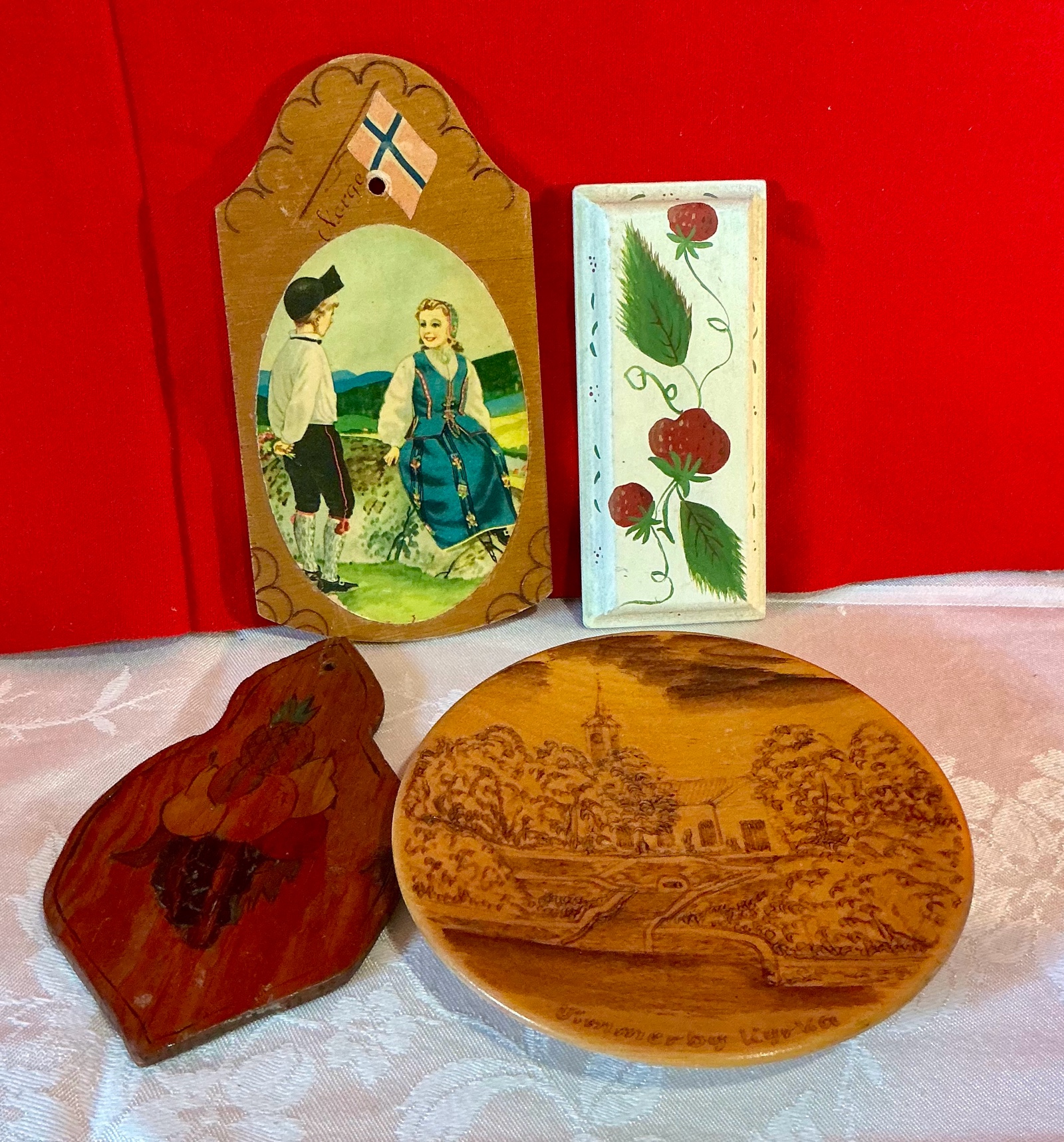 Group of 4 hand painted swiss wood wall hangings