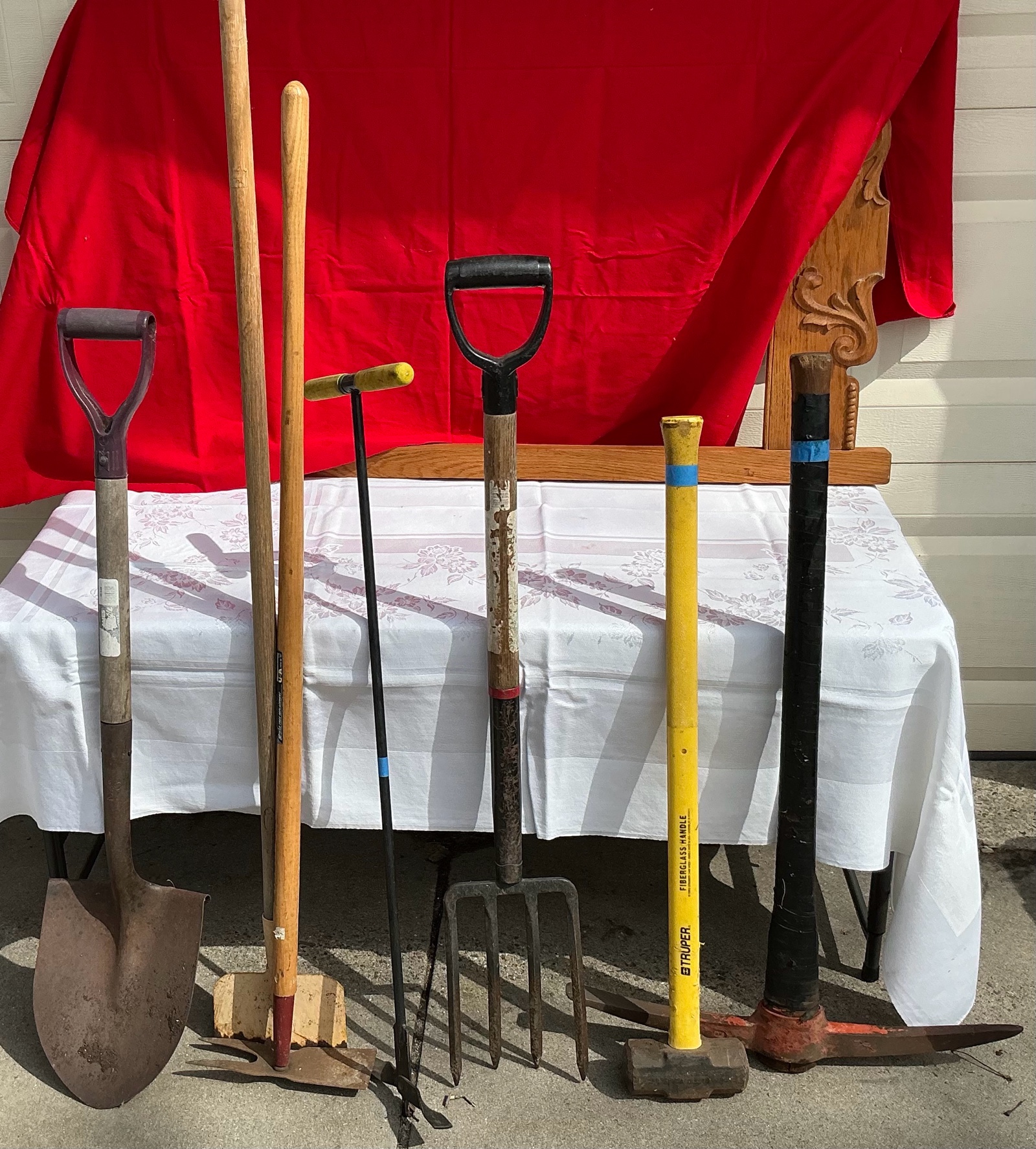 Yard tools shovel, hoe, hatchet, sledge hammer, pick axe