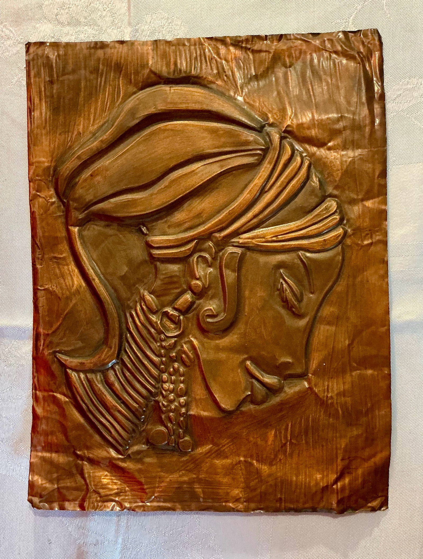 Copper relief indigenous or African woman