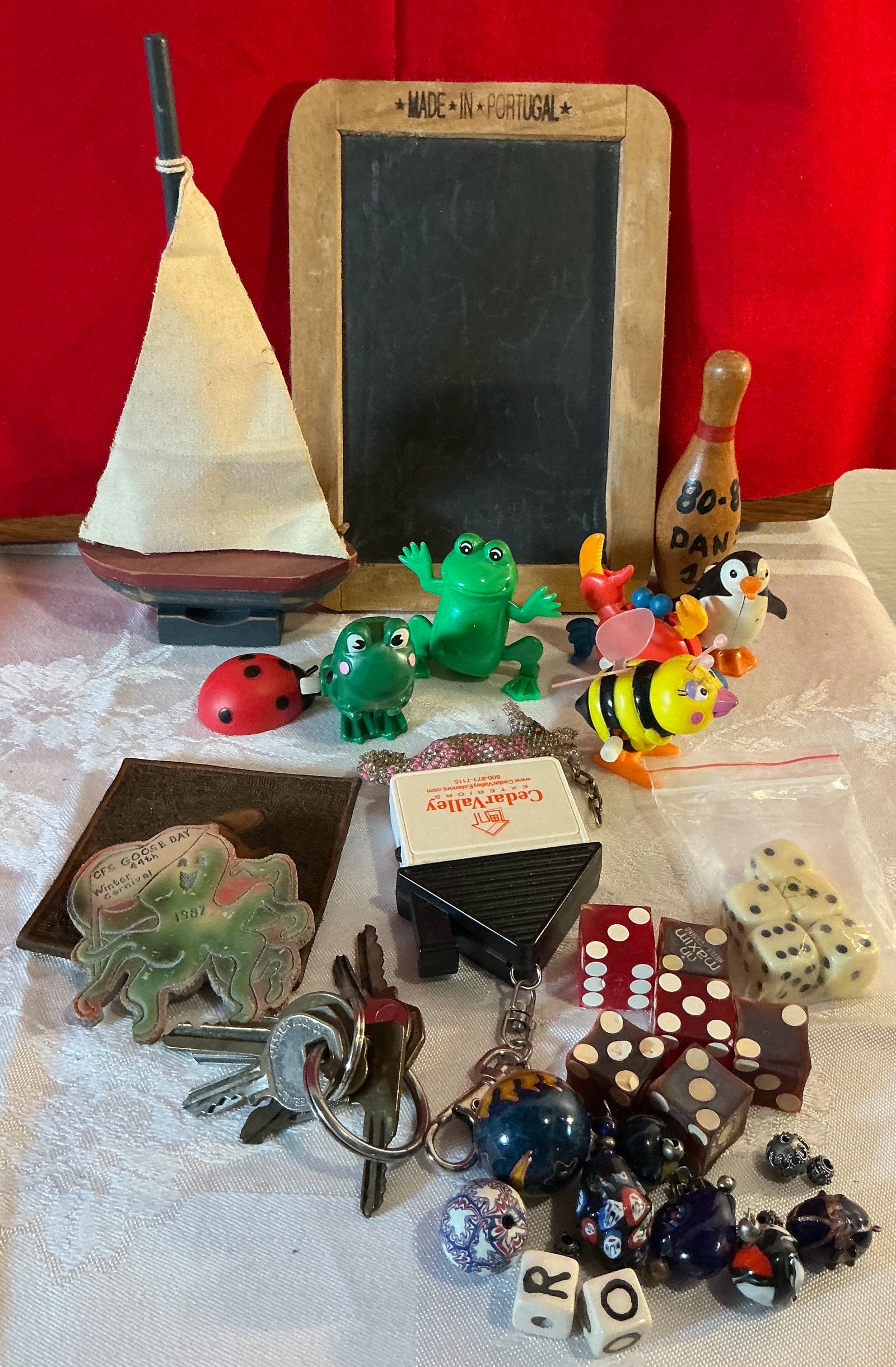 Group of collectable wind up toys, chalkboard, Las Vegas dice