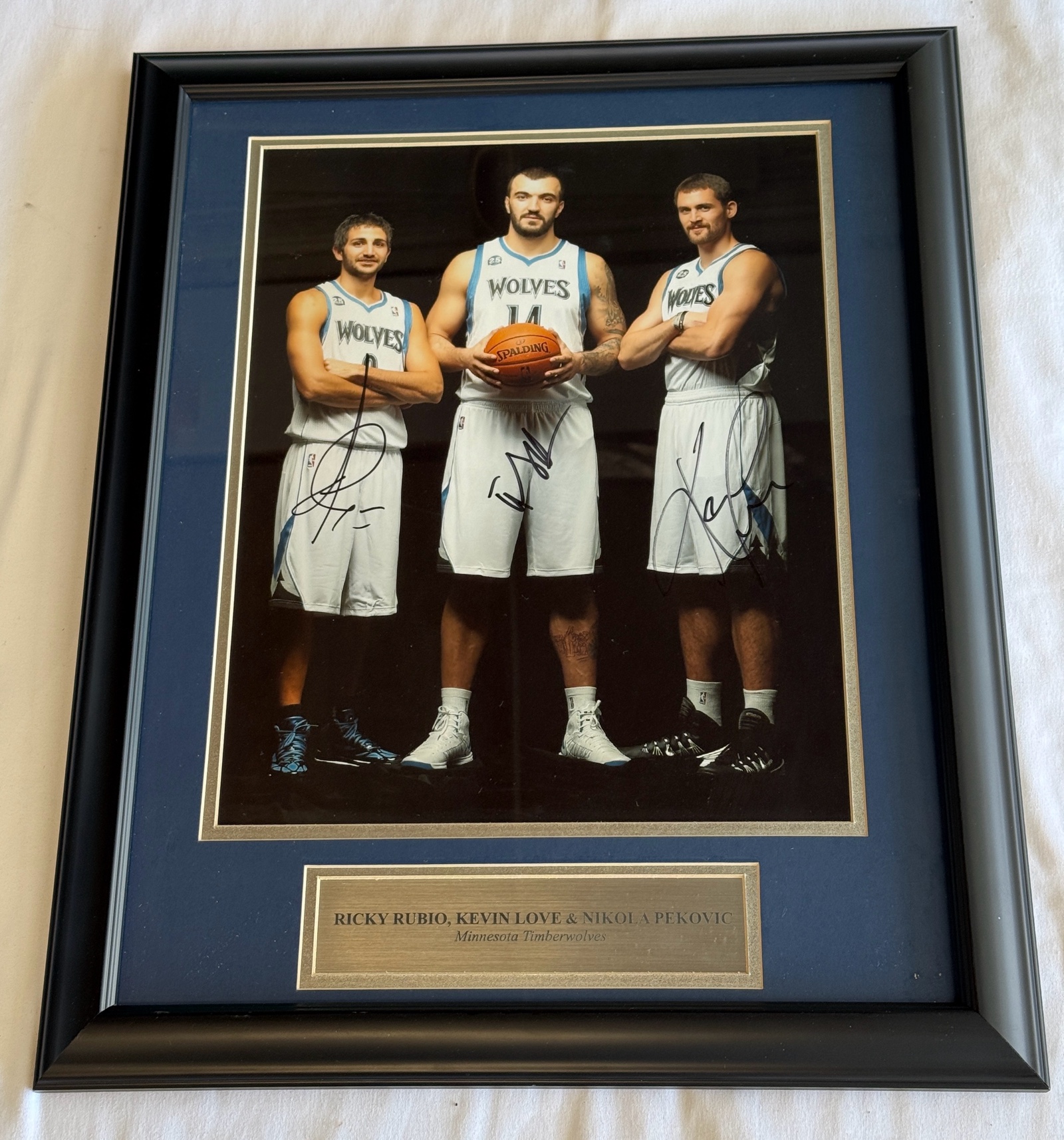 Ricky Rubio, Kevin Love, Nikola Pekovic Autographed Minnesota Timberwolves Basketball Photo - Custom Framed and Matted w Plaque