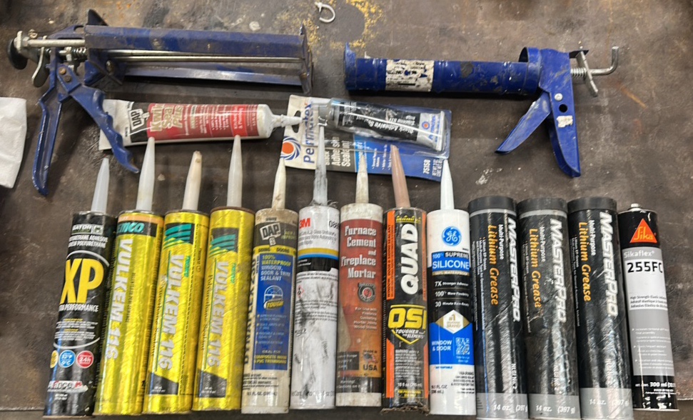 Caulk and caulk guns