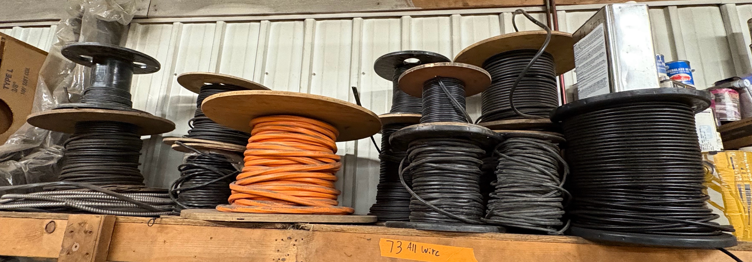 Coils of insulated wire on shelf
