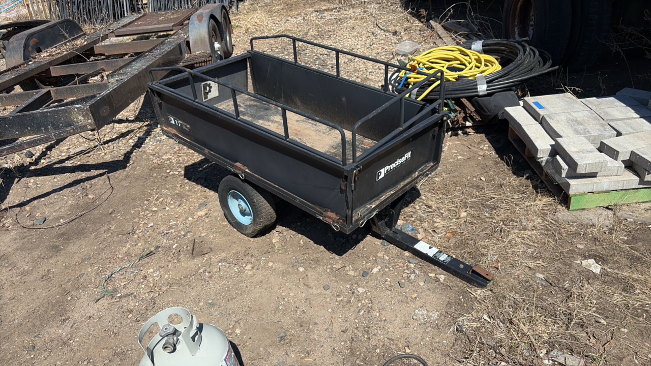PreciseFit tow-behind yard cart, dump style.